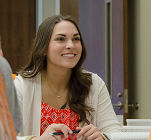 Smiling female student in class