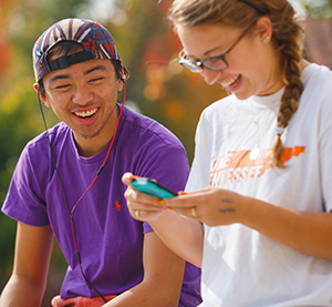 Two students laughing